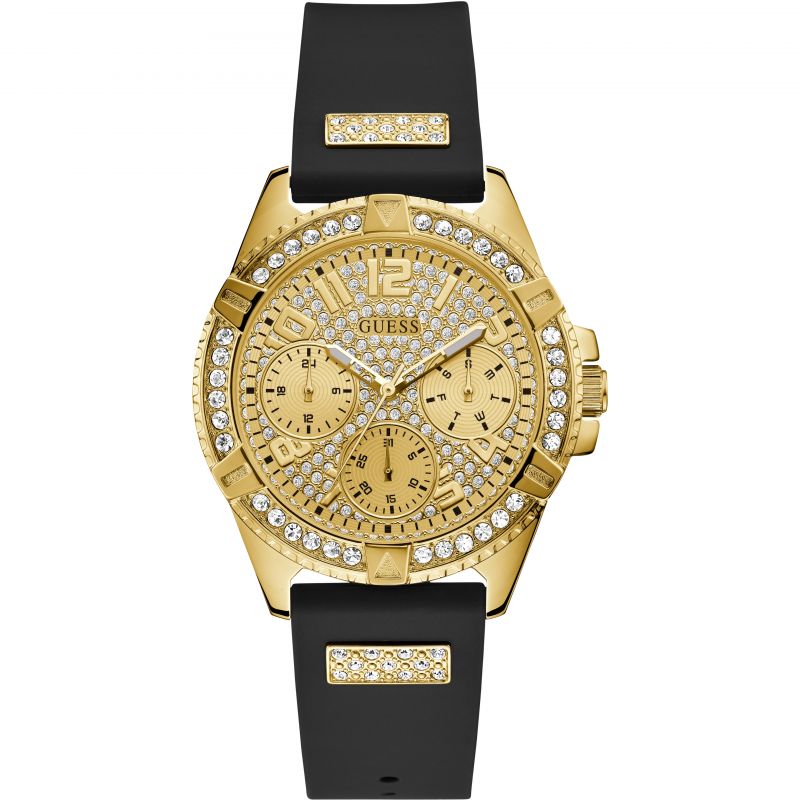 GUESS Ladies gold watch with crystals, champagne glitz multifunction dial and black silicone strap.